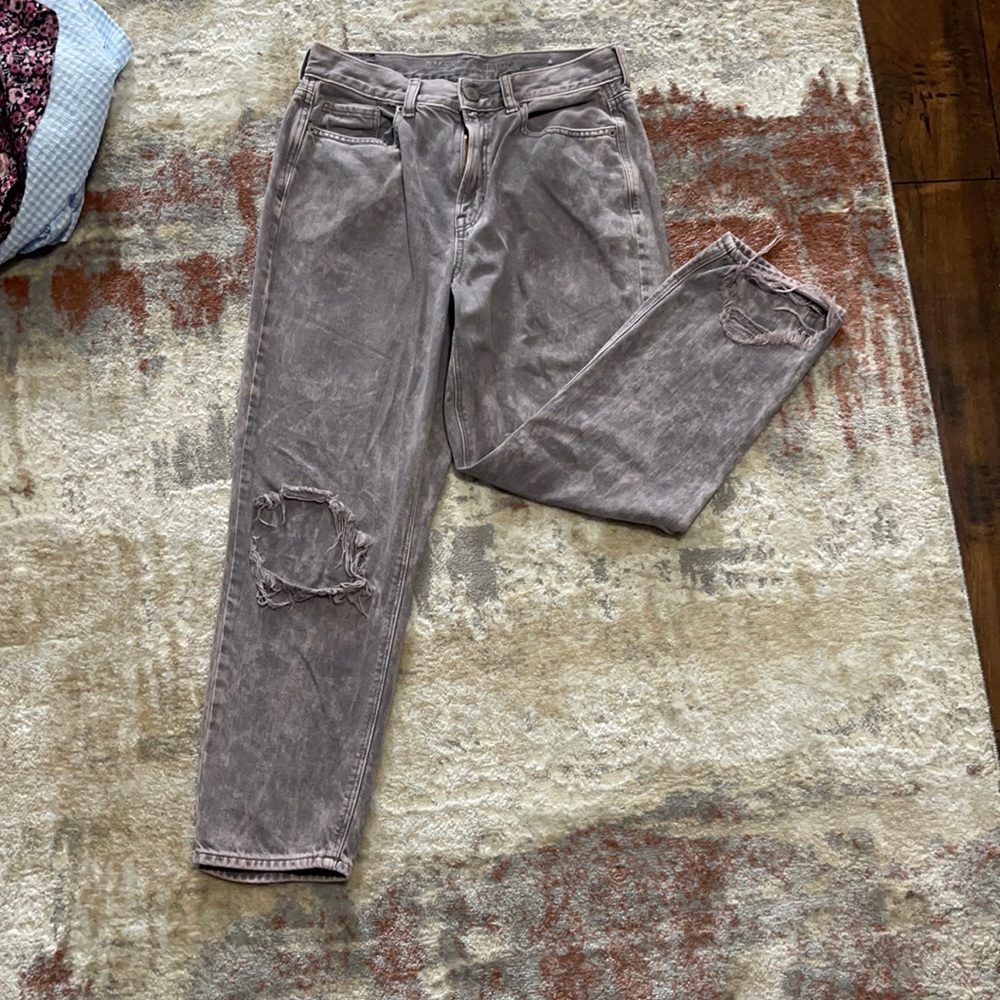 Purple, bleach washed, ripped jeans